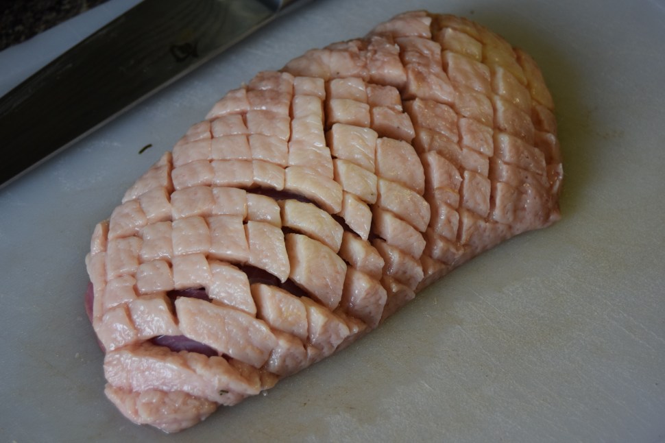 Scored duck, pre-seasoning and pre-skillet.