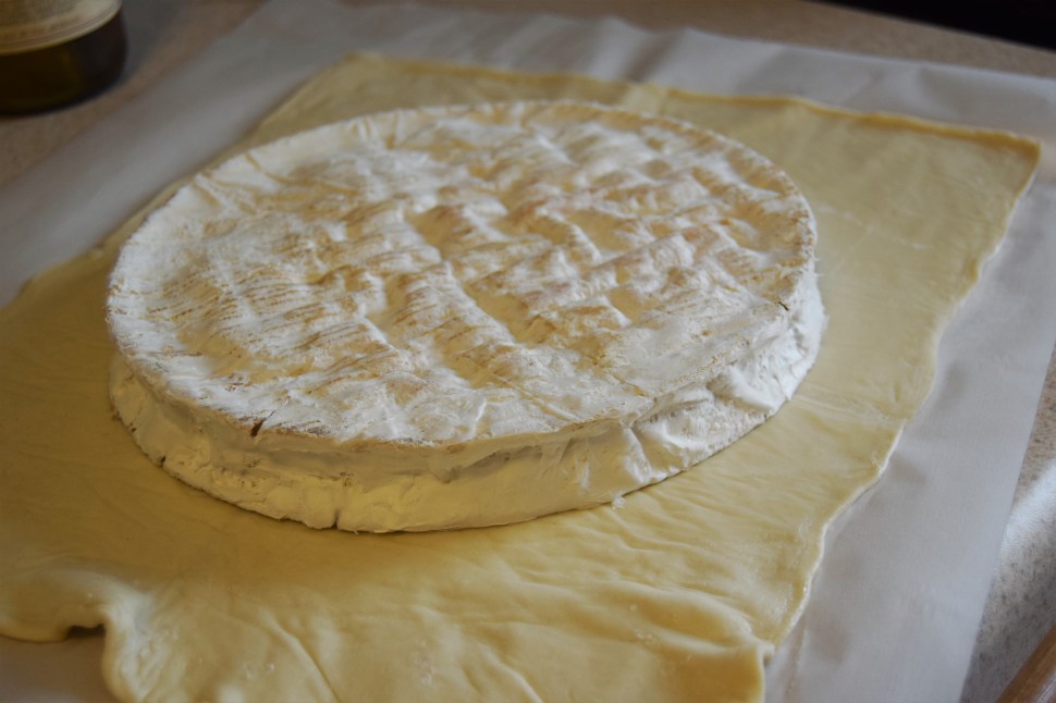 This wheel of brie is bigger than my head.